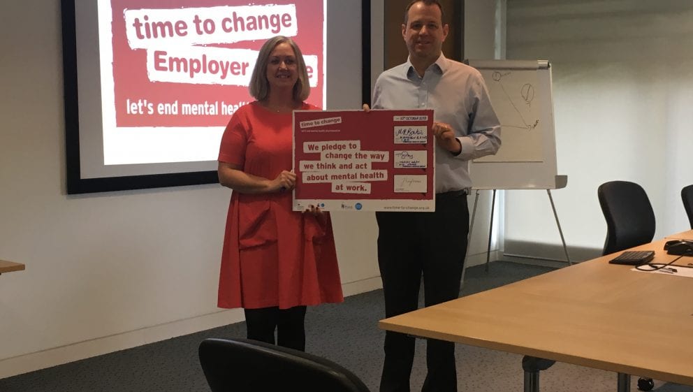 Matthew Bailes and Tracey Gray holding signed Time to change plaque